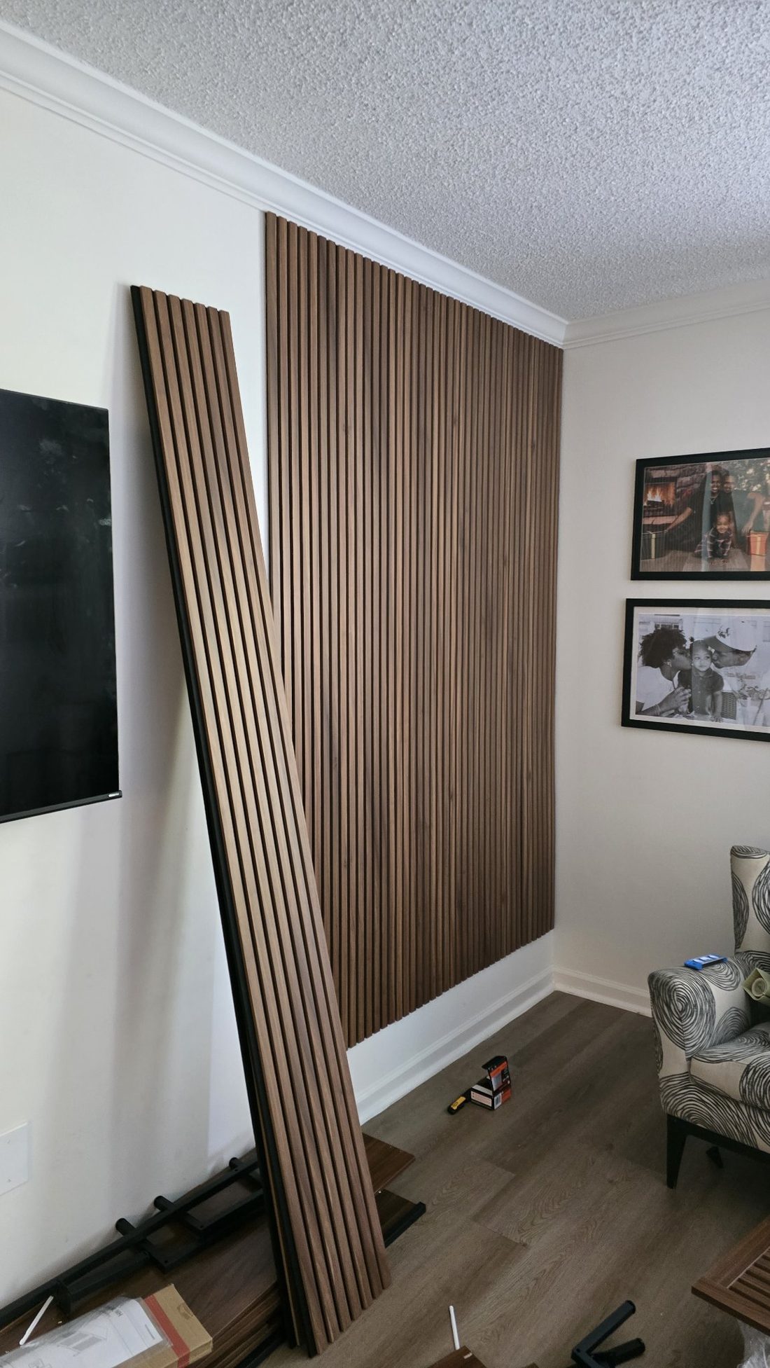 Same wall during installation — panels going up